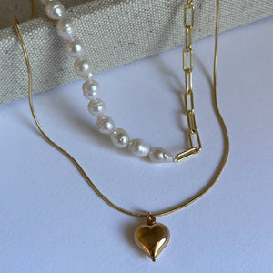 half pearl, half chain necklace paired with heart charm necklace.