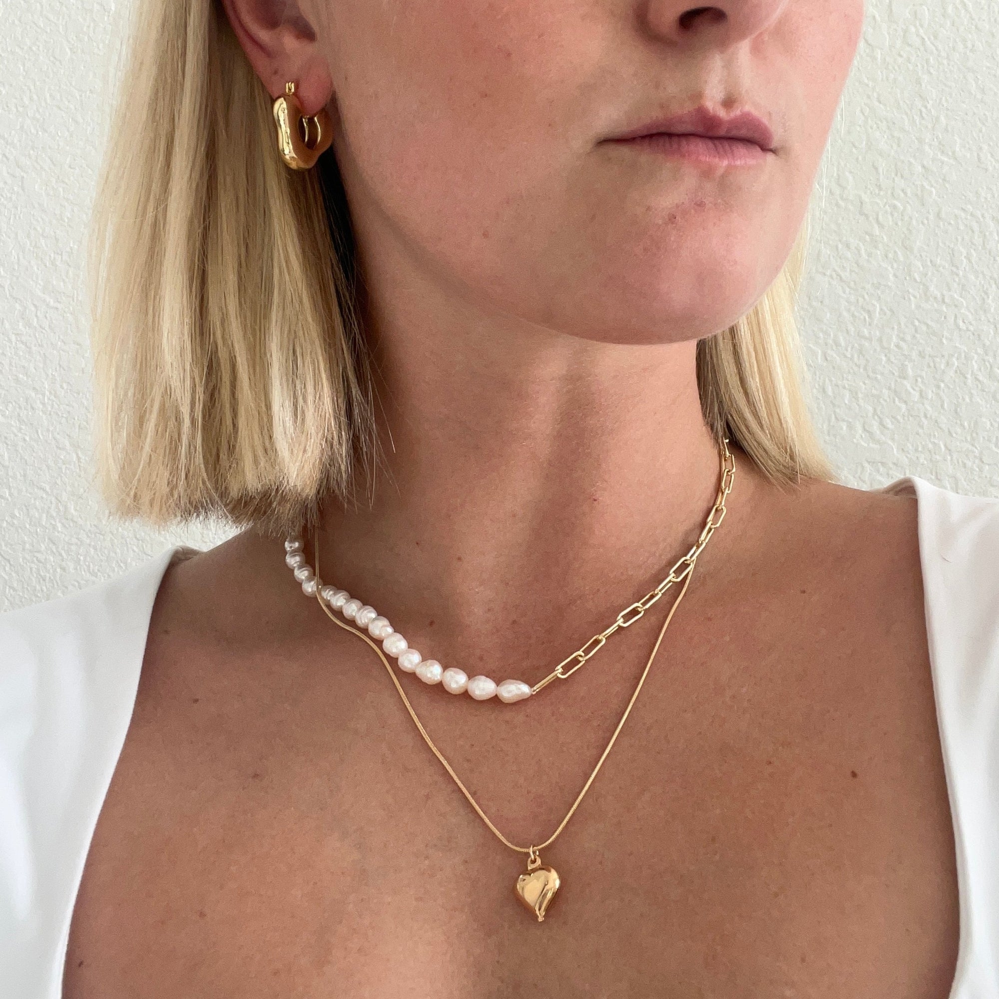 Pearl chain necklace on model. 