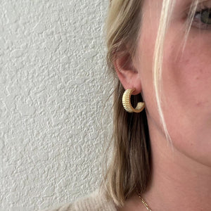 large hoop earrings in gold. 