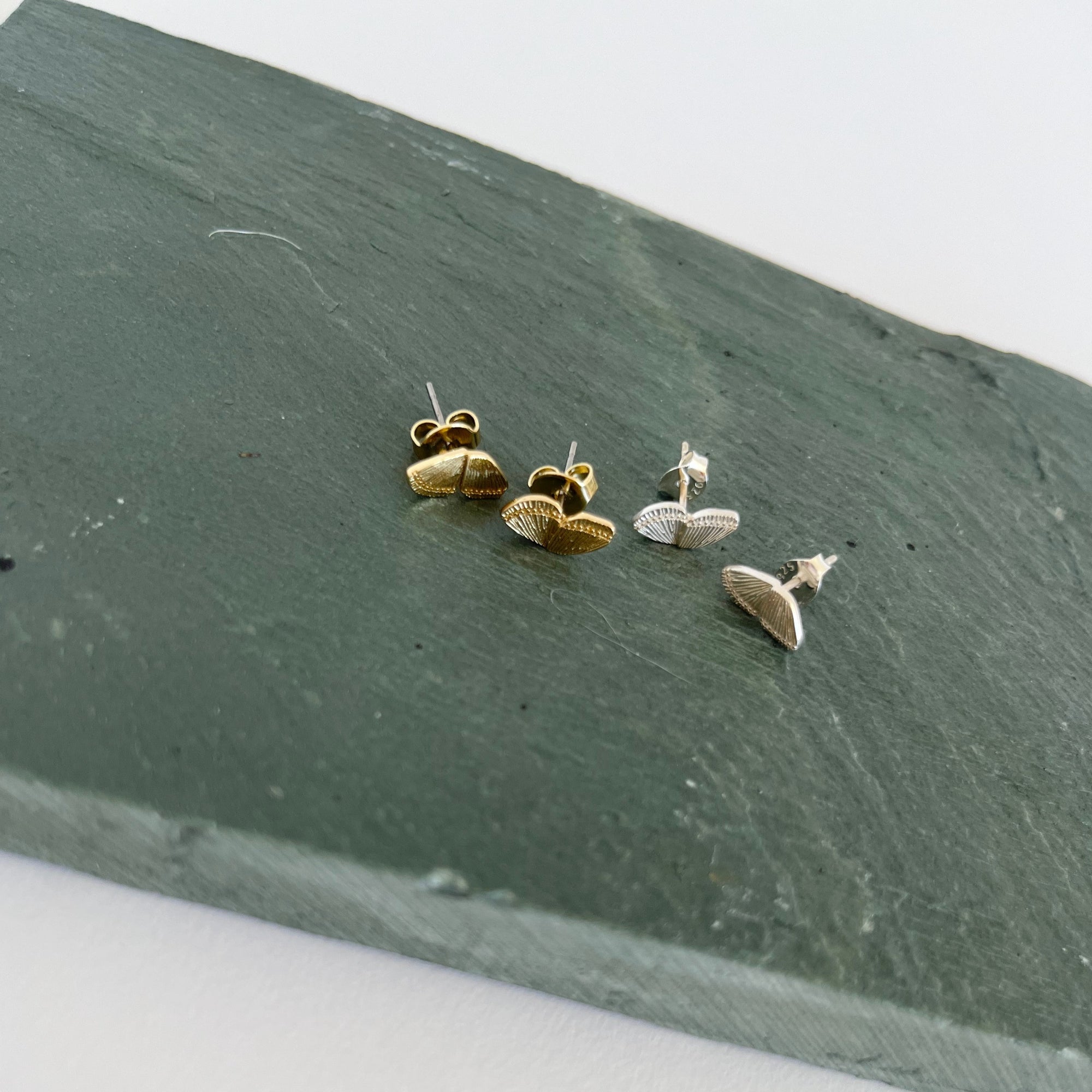 sammi butterfly stud earrings on green rock