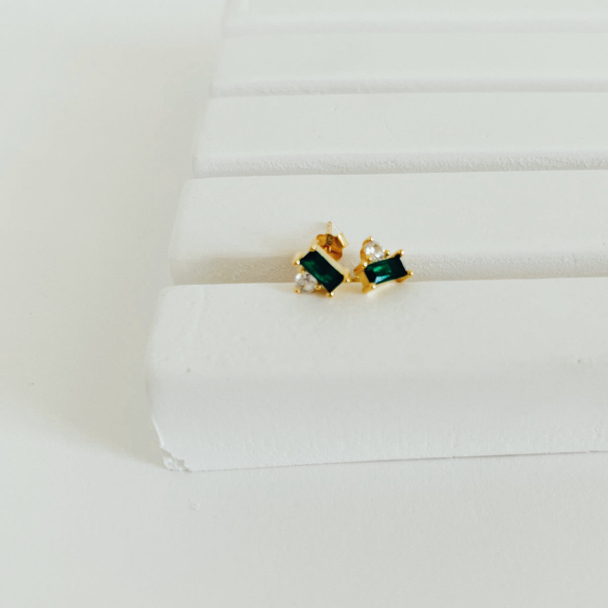 Emerald gold stud earrings.
