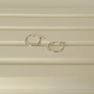 kayla silver hoops displayed on white background.